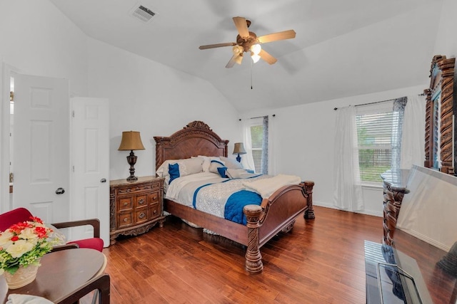bedroom featuring ceiling fan, visible vents, wood finished floors, and lofted ceiling