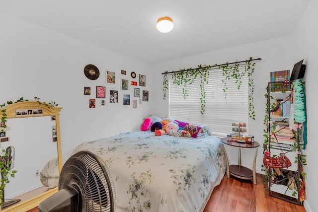 bedroom with wood finished floors