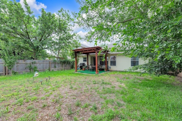 view of yard with a pergola, a fenced backyard, and a patio area