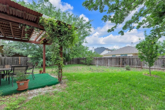 view of yard featuring a pergola and a fenced backyard