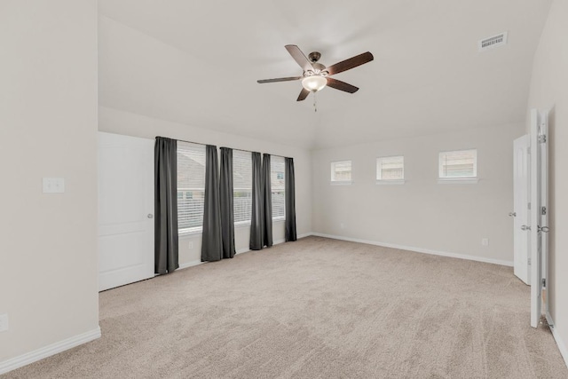 unfurnished room with carpet floors, ceiling fan, baseboards, and visible vents