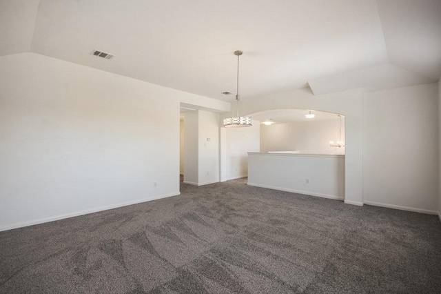 18816 Sandy Shore Dr, Pflugerville, TX 78660 - empty room with carpet floors, visible vents, a chandelier, and vaulted ceiling