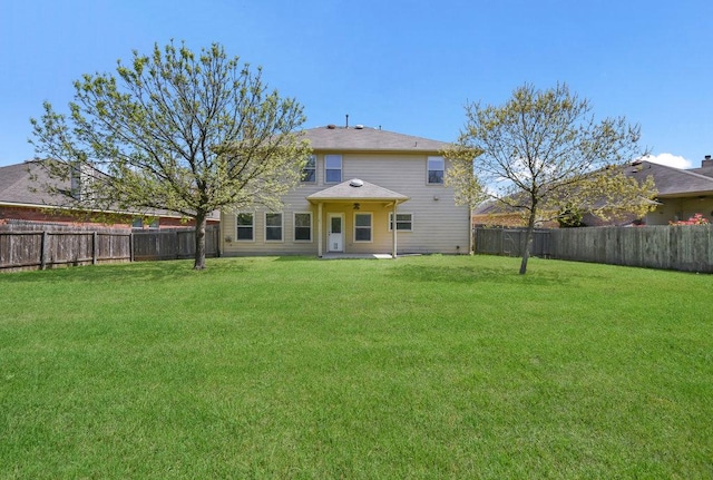 18816 Sandy Shore Dr, Pflugerville, TX 78660 - back of house with a fenced backyard and a yard