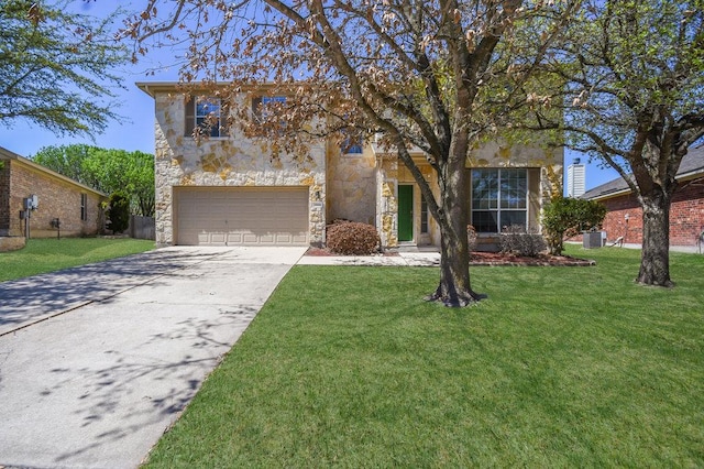 18816 Sandy Shore Dr, Pflugerville, TX 78660 - view of front of house featuring an attached garage, a front lawn, driveway, and stone siding