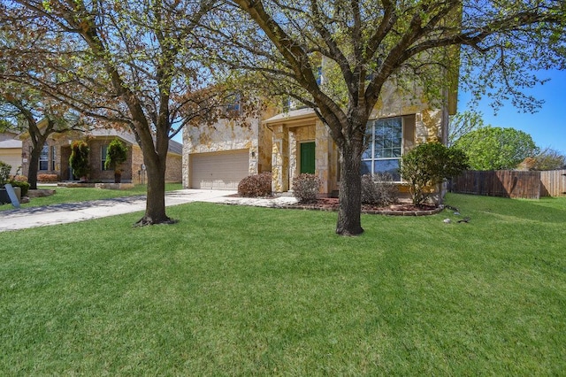 18816 Sandy Shore Dr, Pflugerville, TX 78660 - view of front of home featuring fence, an attached garage, stone siding, a front yard, and driveway