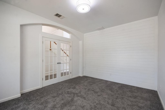 18816 Sandy Shore Dr, Pflugerville, TX 78660 - unfurnished room featuring arched walkways, french doors, dark carpet, and visible vents