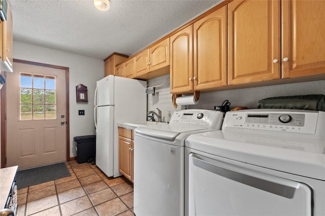991 Fm 20, Cedar Creek, TX 78612 - laundry room featuring separate washer and dryer and a textured ceiling