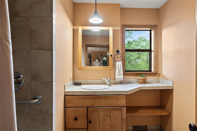 991 Fm 20, Cedar Creek, TX 78612 - bathroom featuring vanity and a tile shower