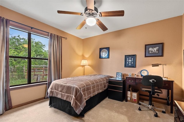 991 Fm 20, Cedar Creek, TX 78612 - carpeted bedroom with a desk and a ceiling fan