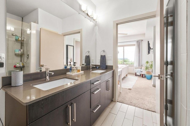 bathroom with a sink, tile patterned floors, and double vanity