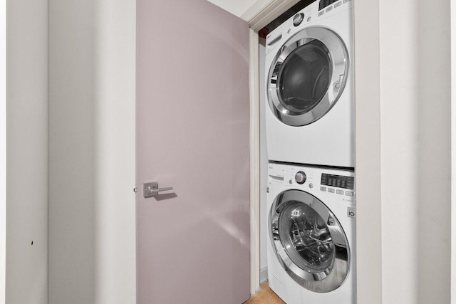 laundry room featuring laundry area and stacked washer / dryer