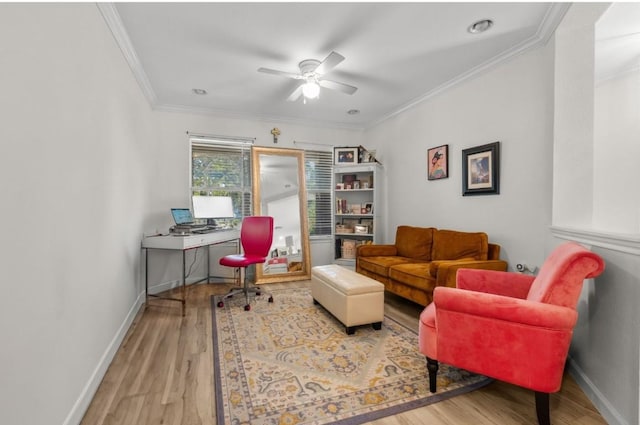 home office with crown molding, ceiling fan, and wood finished floors