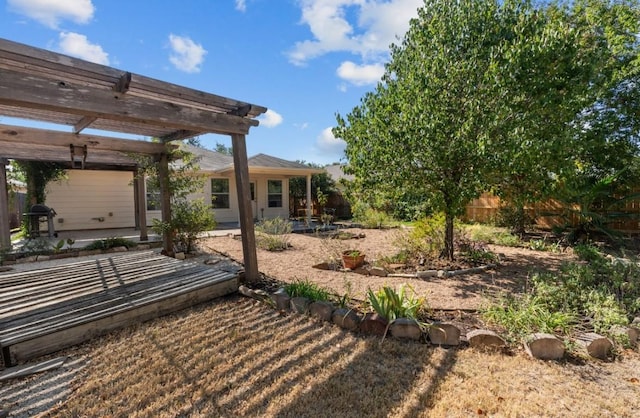 view of yard featuring fence, a pergola, and a patio area