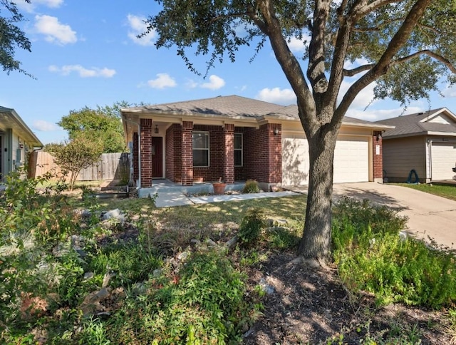 ranch-style home featuring brick siding, an attached garage, fence, and concrete driveway