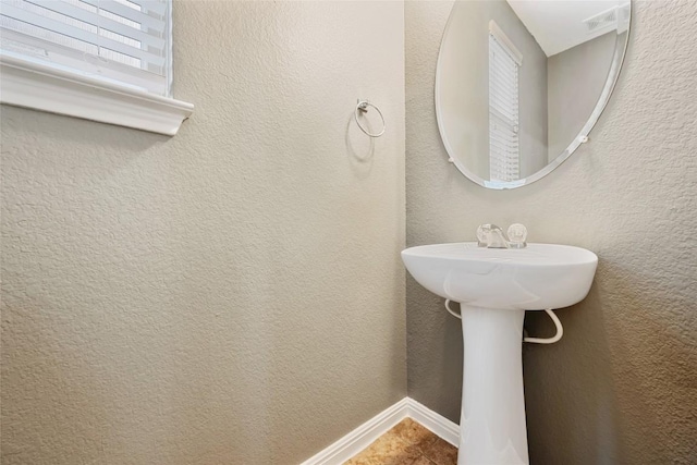 349 Eagle Brook Ln, Buda, TX 78610 - bathroom featuring baseboards and a sink
