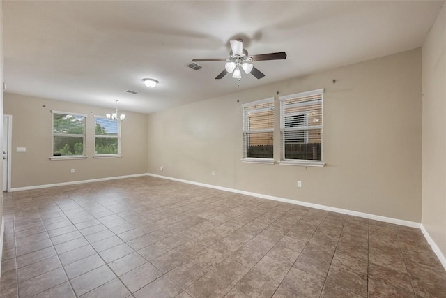 349 Eagle Brook Ln, Buda, TX 78610 - tiled spare room featuring a chandelier, a ceiling fan, and baseboards