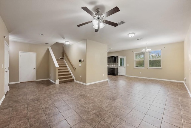 349 Eagle Brook Ln, Buda, TX 78610 - unfurnished living room featuring a chandelier, a ceiling fan, stairs, and tile patterned floors
