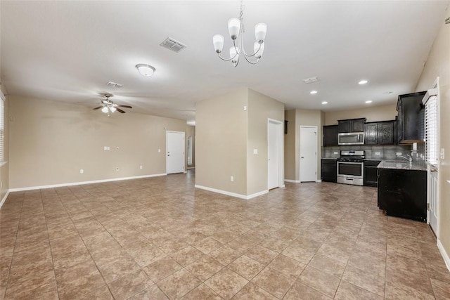 349 Eagle Brook Ln, Buda, TX 78610 - unfurnished living room featuring a chandelier, ceiling fan, baseboards, and recessed lighting