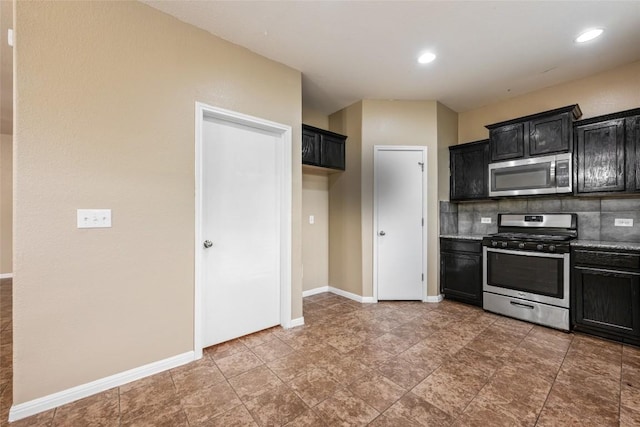 349 Eagle Brook Ln, Buda, TX 78610 - kitchen featuring appliances with stainless steel finishes, dark cabinetry, baseboards, backsplash, and recessed lighting