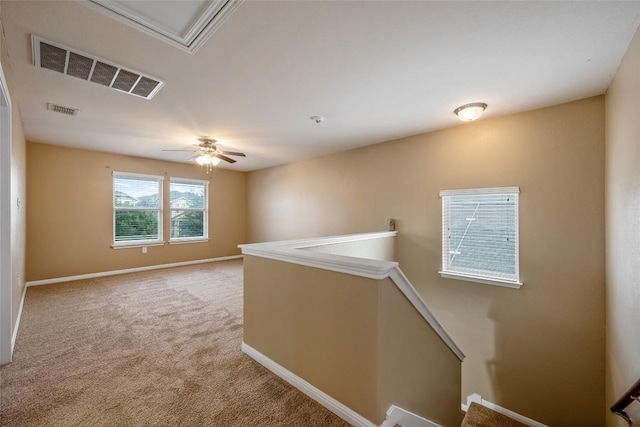 349 Eagle Brook Ln, Buda, TX 78610 - unfurnished room with carpet, baseboards, a ceiling fan, and attic access