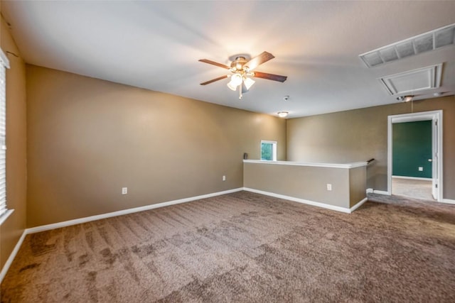 349 Eagle Brook Ln, Buda, TX 78610 - spare room featuring attic access, carpet floors, ceiling fan, and baseboards