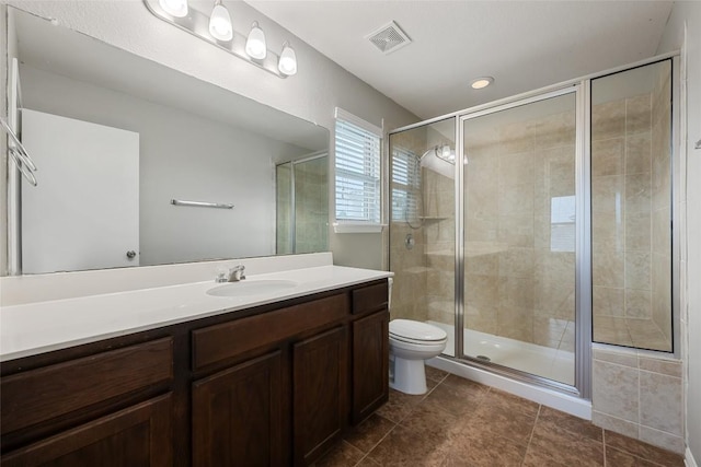 349 Eagle Brook Ln, Buda, TX 78610 - full bathroom with vanity, a shower stall, and tile patterned flooring