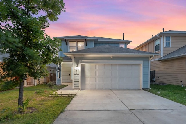 349 Eagle Brook Ln, Buda, TX 78610 - traditional home with concrete driveway, a garage, and a lawn