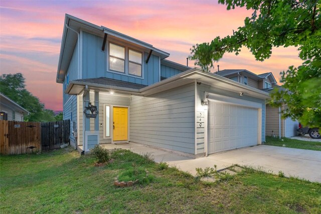 349 Eagle Brook Ln, Buda, TX 78610 - view of front of property featuring board and batten siding, a garage, and concrete driveway
