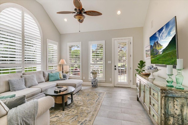 living area featuring recessed lighting, a ceiling fan, vaulted ceiling, and baseboards