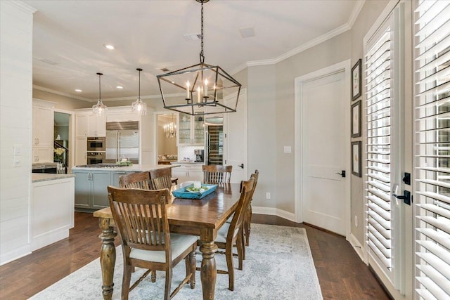 dining room with crown molding, visible vents, dark wood-type flooring, recessed lighting, and a chandelier
