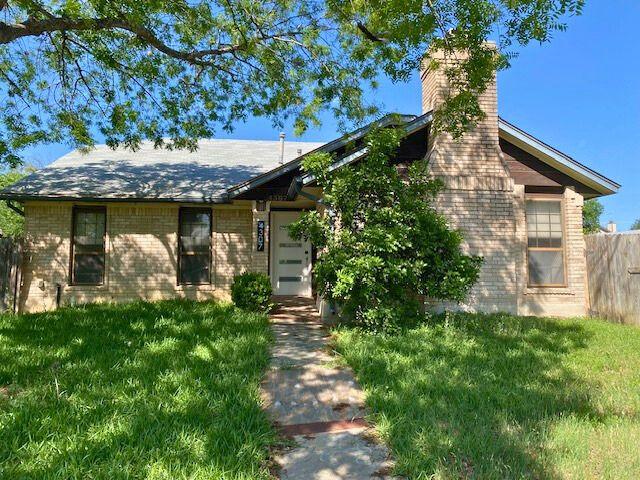 4307 Glenover, San Antonio, TX 78217 - view of front facade with brick siding and a chimney