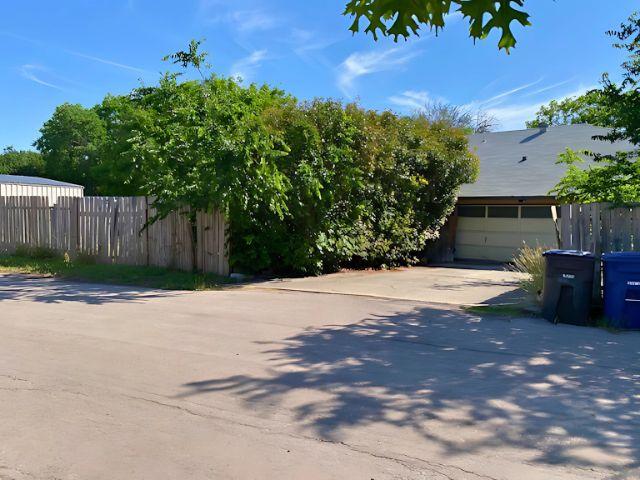 4307 Glenover, San Antonio, TX 78217 - exterior space with concrete driveway, fence, and a garage