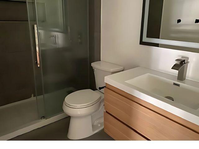 4307 Glenover, San Antonio, TX 78217 - full bath featuring vanity, toilet, and a shower stall