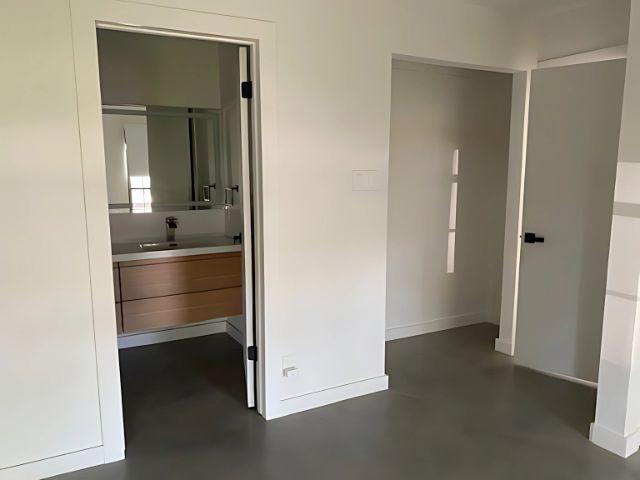 4307 Glenover, San Antonio, TX 78217 - bathroom featuring baseboards, concrete flooring, and vanity