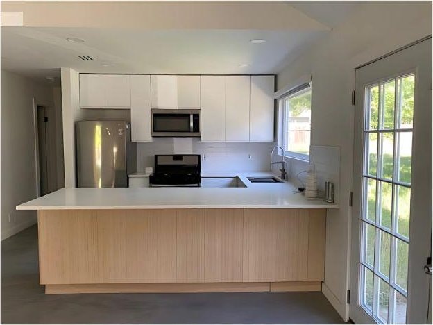 4307 Glenover, San Antonio, TX 78217 - kitchen featuring stainless steel appliances, a sink, a peninsula, light countertops, and white cabinets