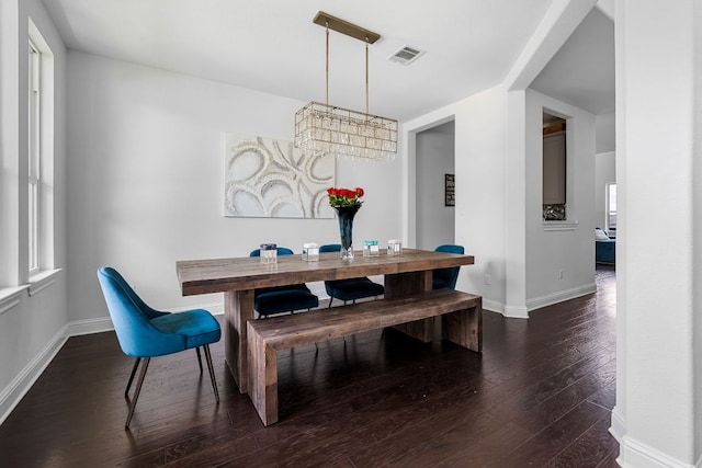 19600 Summit Glory Trl, Spicewood, TX 78669 - dining room featuring dark wood-type flooring, baseboards, a notable chandelier, and visible vents