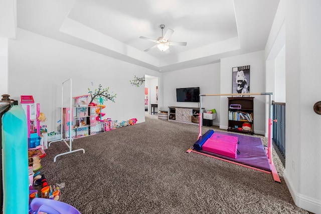 19600 Summit Glory Trl, Spicewood, TX 78669 - rec room featuring carpet floors, ceiling fan, baseboards, and a tray ceiling
