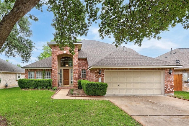 traditional-style house featuring concrete driveway, brick siding, an attached garage, and roof with shingles