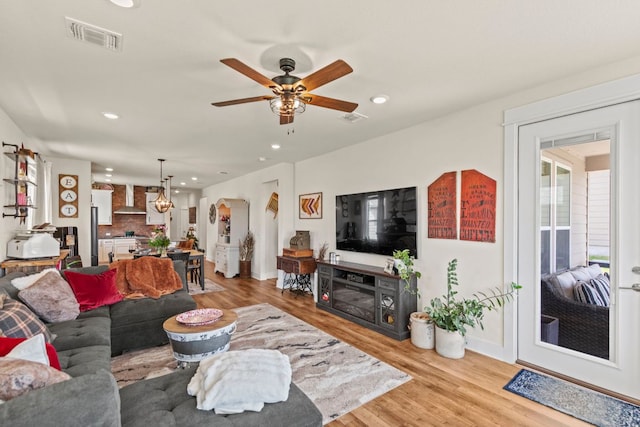 711 Livewater Ln, Georgetown, TX 78633 - living area with recessed lighting, light wood-style floors, a ceiling fan, and baseboards
