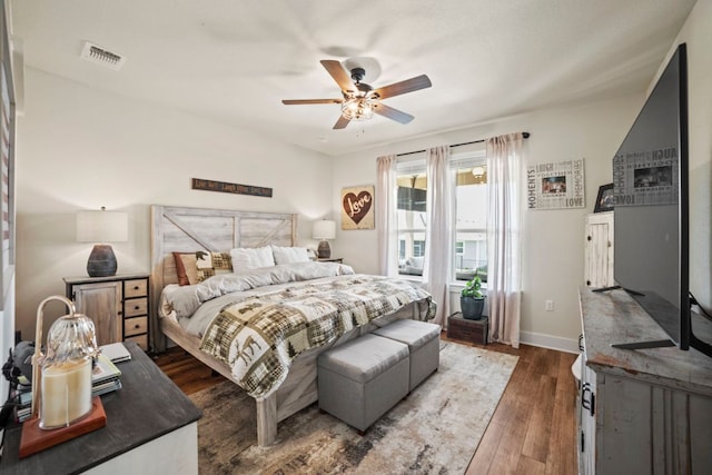 711 Livewater Ln, Georgetown, TX 78633 - bedroom with wood finished floors, baseboards, and a ceiling fan