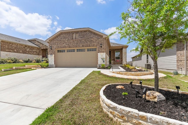 711 Livewater Ln, Georgetown, TX 78633 - view of front of house featuring brick siding, a garage, driveway, and a front yard