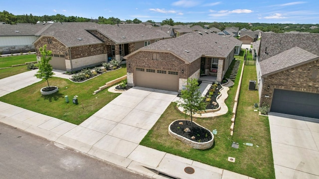 711 Livewater Ln, Georgetown, TX 78633 - ranch-style house with driveway, brick siding, a garage, and a residential view