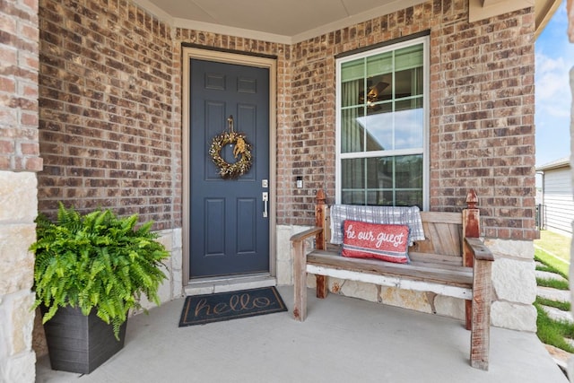 711 Livewater Ln, Georgetown, TX 78633 - doorway to property featuring brick siding and covered porch