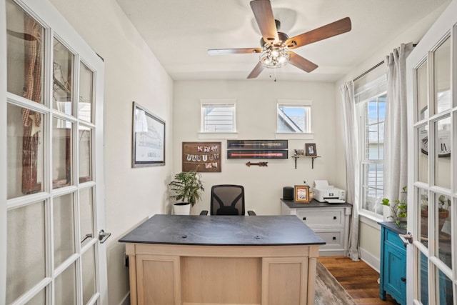 711 Livewater Ln, Georgetown, TX 78633 - home office with dark wood-style floors, ceiling fan, and baseboards