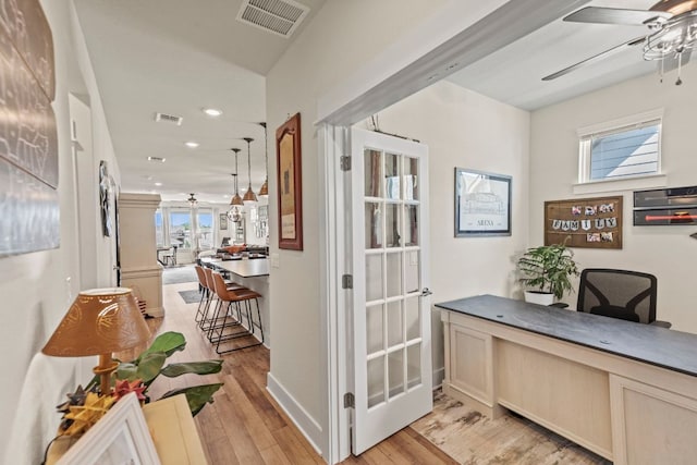 711 Livewater Ln, Georgetown, TX 78633 - hallway with a desk, light wood finished floors, and recessed lighting