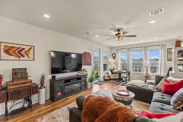 711 Livewater Ln, Georgetown, TX 78633 - living room featuring a ceiling fan, wood finished floors, recessed lighting, and baseboards