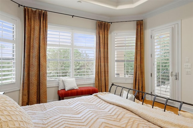 7921 W Rim Dr, Austin, TX 78731 - bedroom with access to exterior, multiple windows, crown molding, and wood finished floors