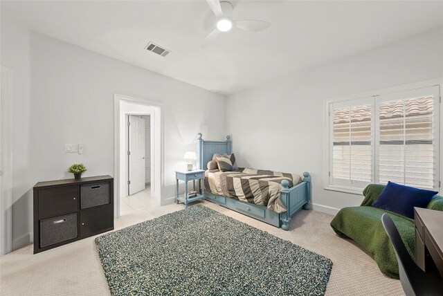7921 W Rim Dr, Austin, TX 78731 - carpeted bedroom with baseboards and a ceiling fan