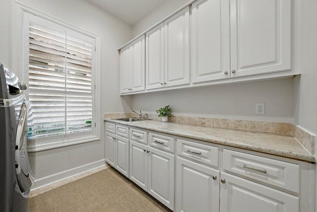 7921 W Rim Dr, Austin, TX 78731 - washroom with cabinet space and washer / clothes dryer