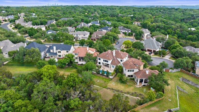 7921 W Rim Dr, Austin, TX 78731 - aerial view of property and surrounding area with nearby suburban area